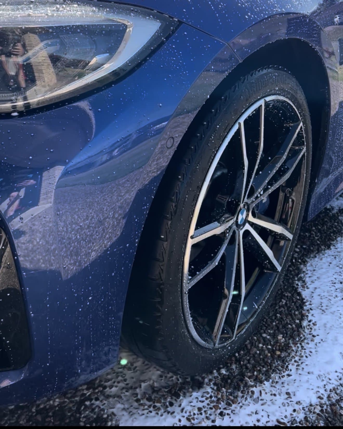 Water beading on a freshly washed ceramic-coated panel and wheel