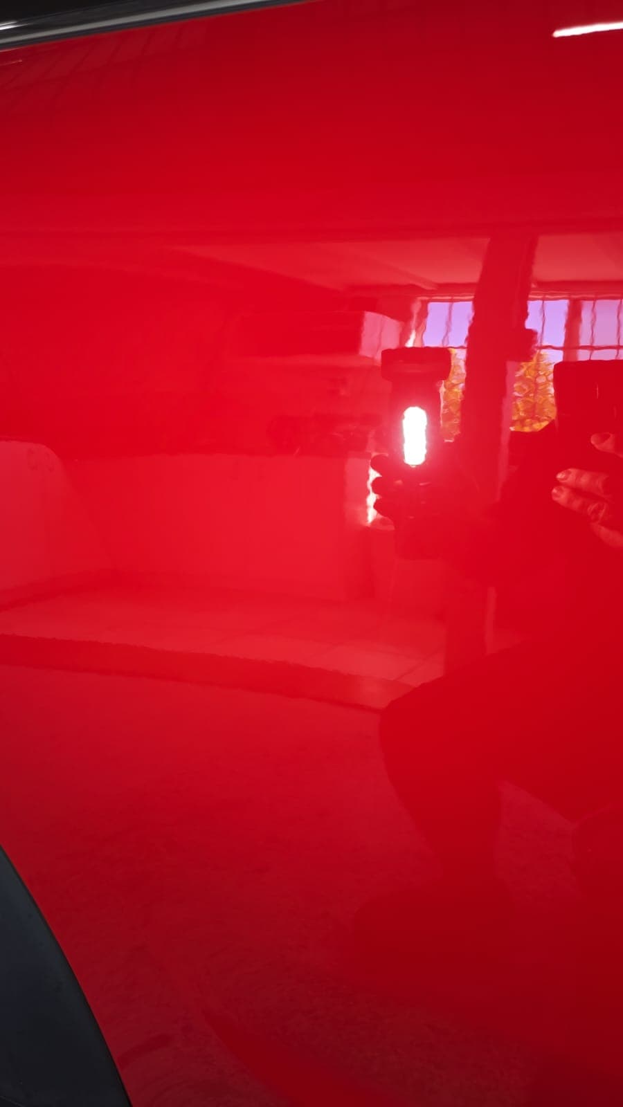 Same vehicle panel after paint correction, showing corrected gloss finish