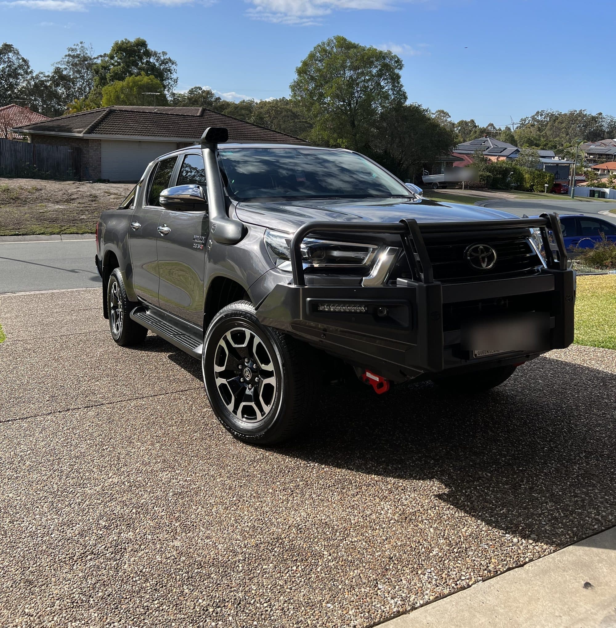 Toyota HiLux fitted with a bull bar, parked in a driveway